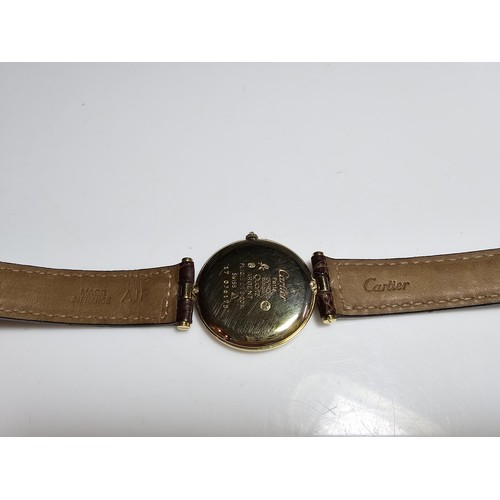 249B - A good quality genuine ladies Cartier watch, 925 silver gold plated with the flower and duck emblem ... 