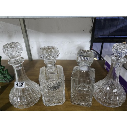 448 - A quantity of 4 pressed glass decanters including 2 port decanters and 2 whisky decanters. 1 whisky ... 