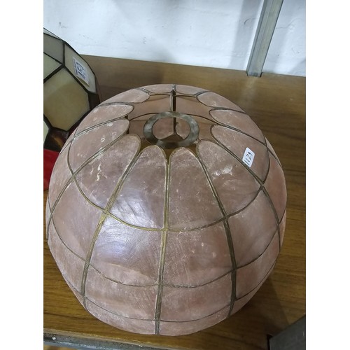 450 - A Tiffany style glass lampshade in red and cream along with a 1950's pink lampshade, both in overall... 