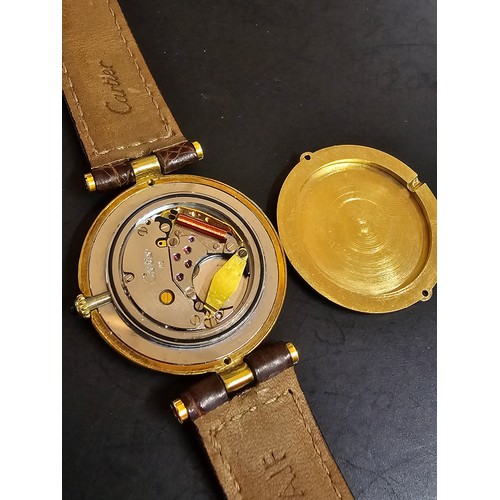 249B - A good quality genuine ladies Cartier watch, 925 silver gold plated with the flower and duck emblem ... 