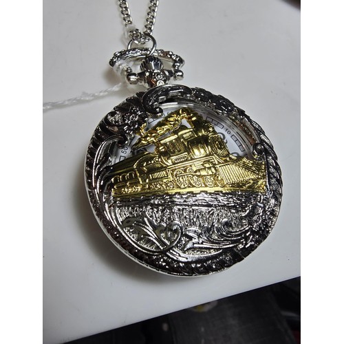 222 - As new ornate pocket watch with a locomotive design along with Siskiyou American belt buckle with a ... 