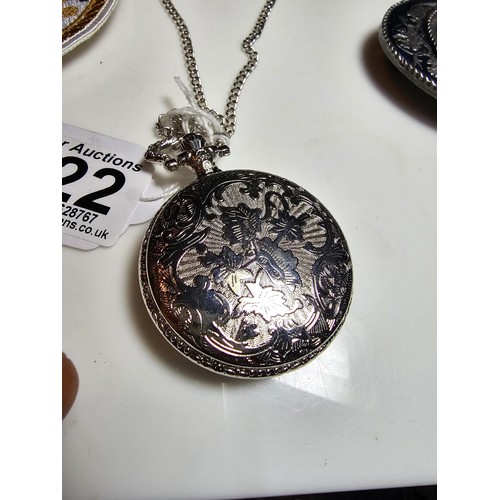 222 - As new ornate pocket watch with a locomotive design along with Siskiyou American belt buckle with a ... 