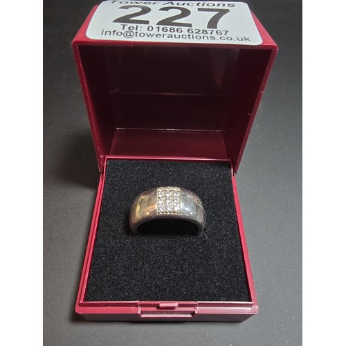 227 - 925 chunky silver ring inset with cz stones by Fossil size , in good condition boxed size K.