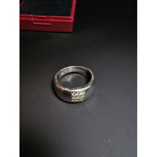 227 - 925 chunky silver ring inset with cz stones by Fossil size , in good condition boxed size K.