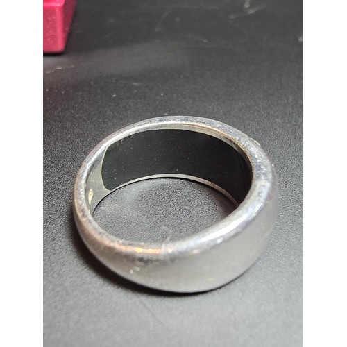 227 - 925 chunky silver ring inset with cz stones by Fossil size , in good condition boxed size K.