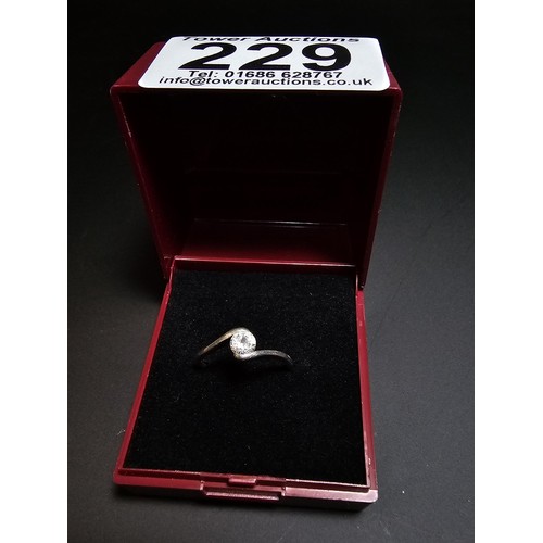 229 - pretty 925 silver solitaire ring inset with a cz crystal stone. in good condition boxed, size K.5