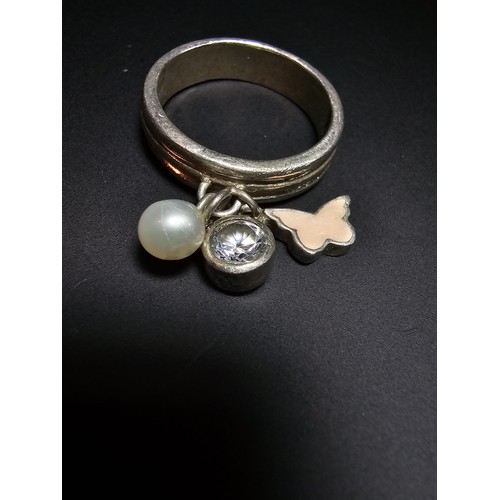 230 - 925 silver ring featuring 3x charms which includes a real pearl. in good condition boxed, size M.5