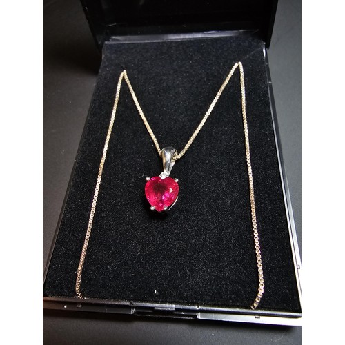 231 - Stunning 925 silver pendant inset with a heart shaped pink/red topaz stone & a small clear topaz sto... 