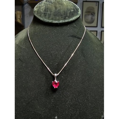 231 - Stunning 925 silver pendant inset with a heart shaped pink/red topaz stone & a small clear topaz sto... 