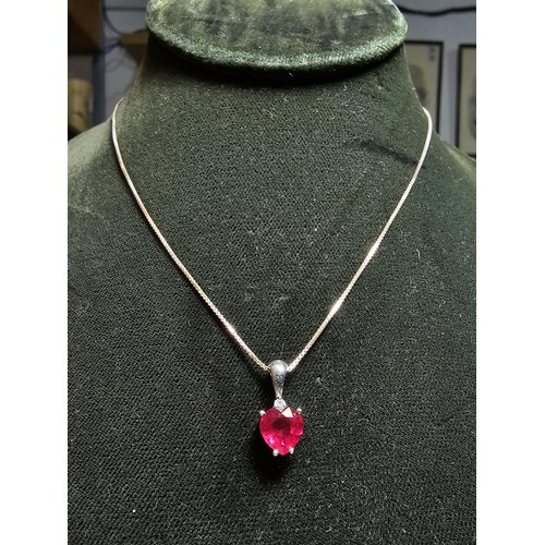 231 - Stunning 925 silver pendant inset with a heart shaped pink/red topaz stone & a small clear topaz sto... 