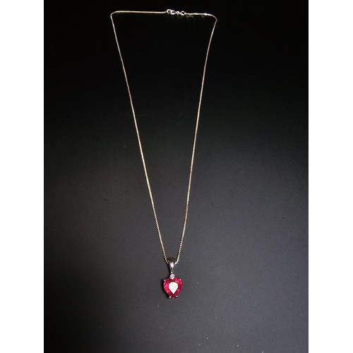 231 - Stunning 925 silver pendant inset with a heart shaped pink/red topaz stone & a small clear topaz sto... 