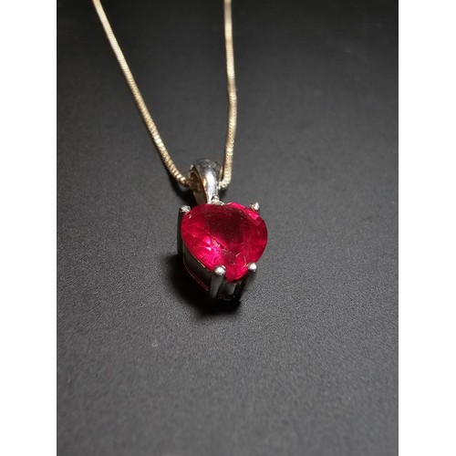 231 - Stunning 925 silver pendant inset with a heart shaped pink/red topaz stone & a small clear topaz sto... 