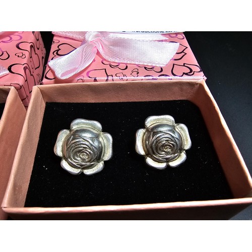 234 - Pair of 925 silver rose formed clip on earrings along with a chanel style pair of earrings. in good ... 