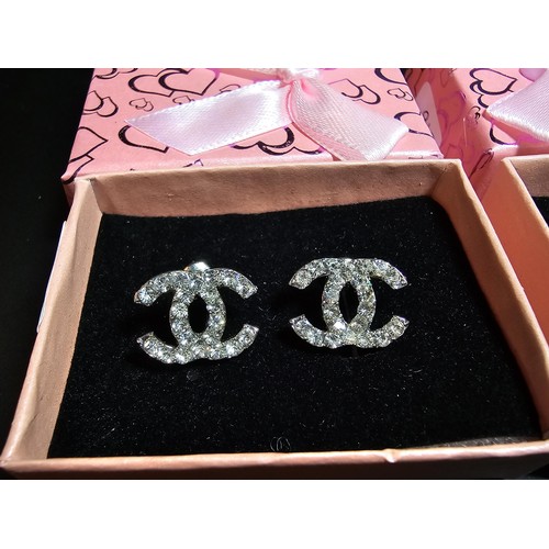 234 - Pair of 925 silver rose formed clip on earrings along with a chanel style pair of earrings. in good ... 