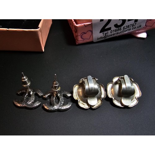 234 - Pair of 925 silver rose formed clip on earrings along with a chanel style pair of earrings. in good ... 