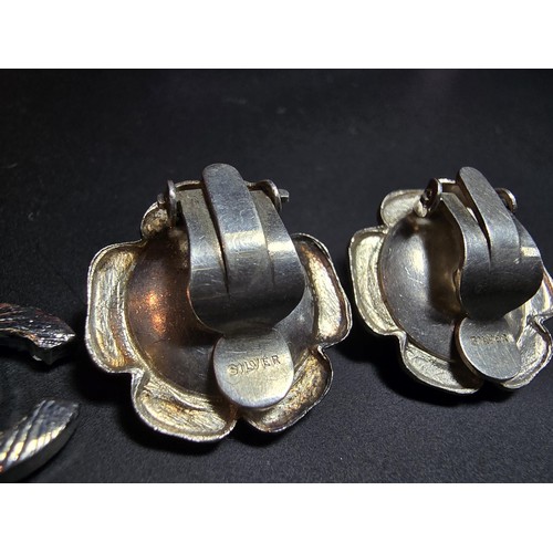 234 - Pair of 925 silver rose formed clip on earrings along with a chanel style pair of earrings. in good ... 