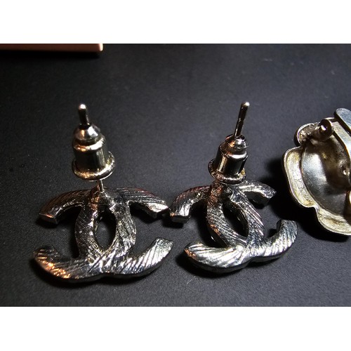 234 - Pair of 925 silver rose formed clip on earrings along with a chanel style pair of earrings. in good ... 