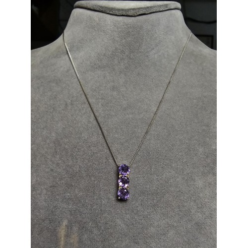 237 - pretty 925 silver pendant inset with 3 faceted amethyst gemstones, set on a 16