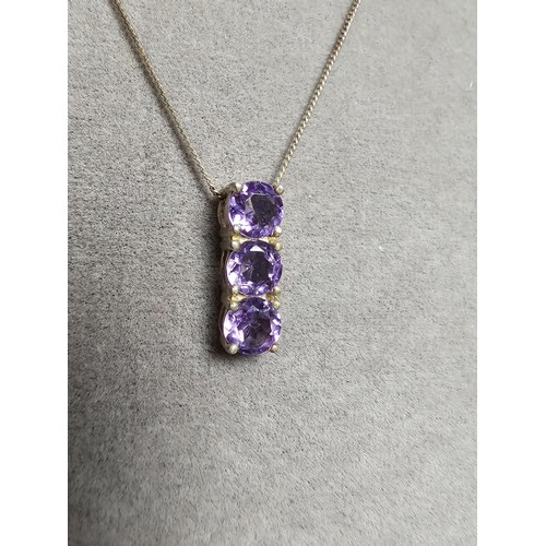 237 - pretty 925 silver pendant inset with 3 faceted amethyst gemstones, set on a 16