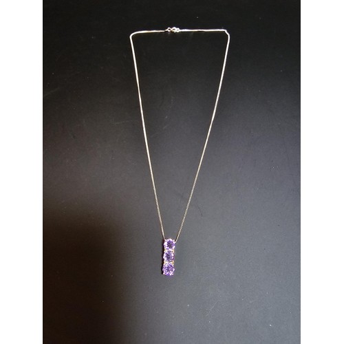 237 - pretty 925 silver pendant inset with 3 faceted amethyst gemstones, set on a 16