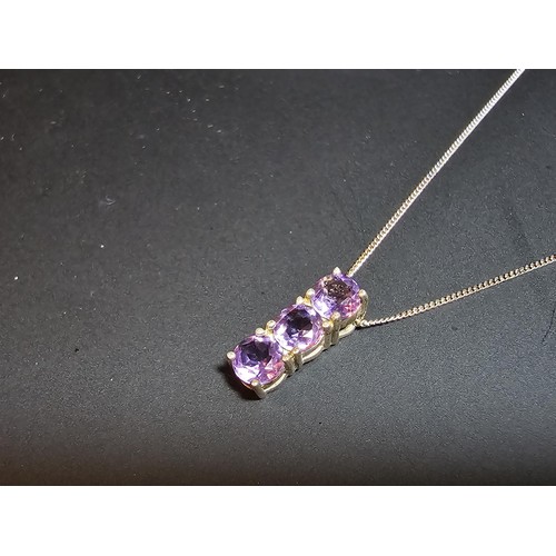 237 - pretty 925 silver pendant inset with 3 faceted amethyst gemstones, set on a 16