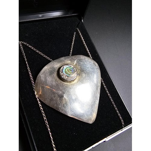 244 - Large 925 silver pendant inset with colourful abalone shell, set on a very long 24