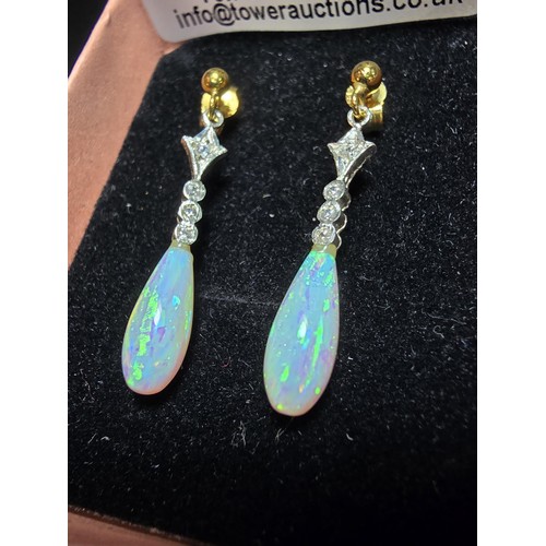 247 - Pair of stunning 925 silver drop earrings set with clear cz stones and faux opal drops which feature... 