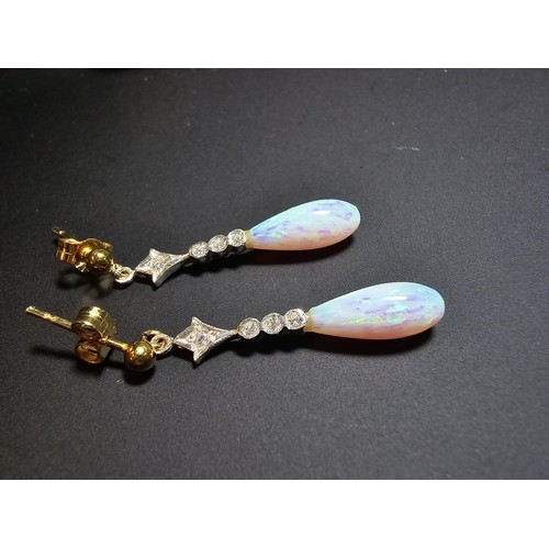 247 - Pair of stunning 925 silver drop earrings set with clear cz stones and faux opal drops which feature... 