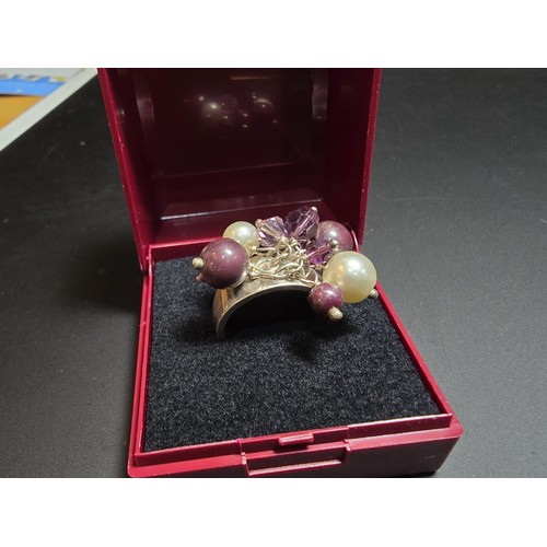 248 - ornate 925 silver ring featuring a cluster of faux pearls and purple glass beads, in good clean cond... 