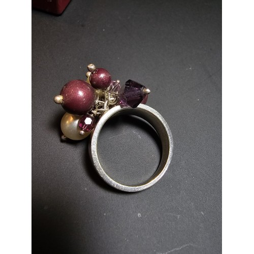 248 - ornate 925 silver ring featuring a cluster of faux pearls and purple glass beads, in good clean cond... 