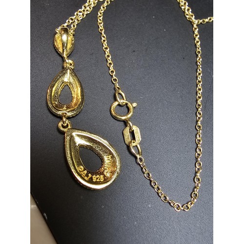 260 - Pretty gilt 925 silver drop pendant set on a 18