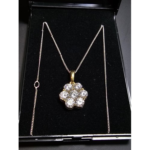 261 - Stunning gilt 925 silver flower formed pendant inset with very sparkly CZ crystal stones which catch... 