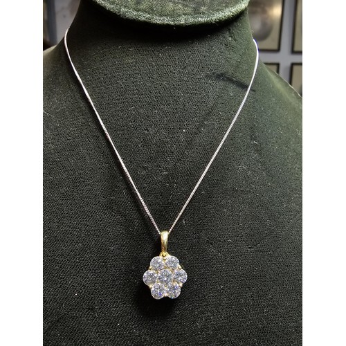 261 - Stunning gilt 925 silver flower formed pendant inset with very sparkly CZ crystal stones which catch... 