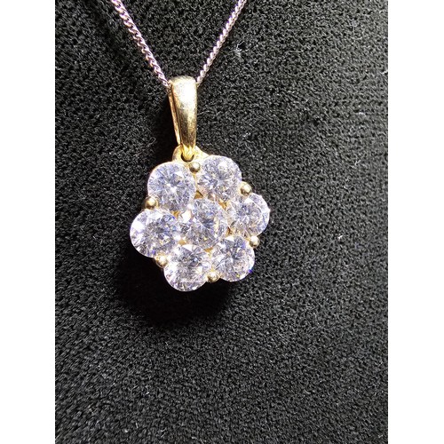 261 - Stunning gilt 925 silver flower formed pendant inset with very sparkly CZ crystal stones which catch... 