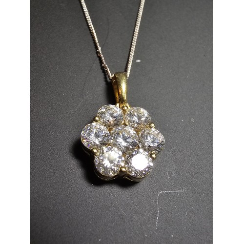 261 - Stunning gilt 925 silver flower formed pendant inset with very sparkly CZ crystal stones which catch... 