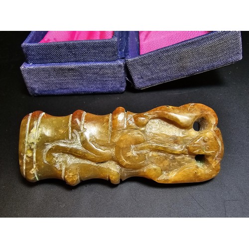 263 - Cased Carved Jade belt charm, featuring a monkey scene. height of 6.5cm width of 2.5cm