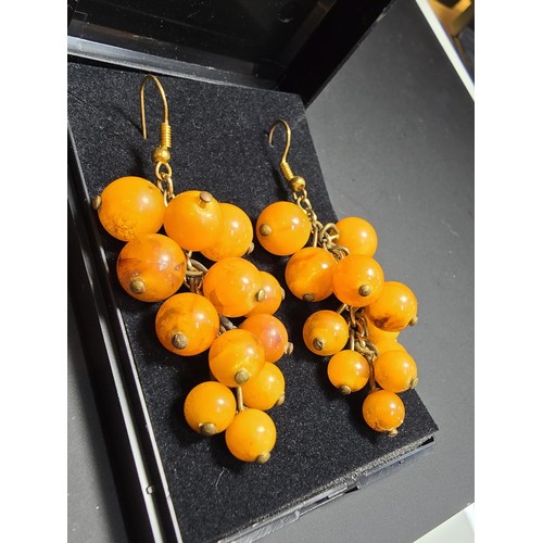 265 - Pair of vintage stunning genuine amber beaded drop earrings in the form of a bunch of grapes, each a... 