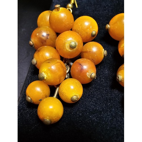 265 - Pair of vintage stunning genuine amber beaded drop earrings in the form of a bunch of grapes, each a... 