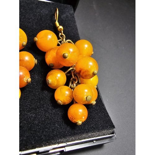 265 - Pair of vintage stunning genuine amber beaded drop earrings in the form of a bunch of grapes, each a... 