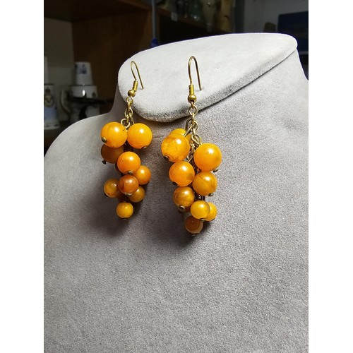 265 - Pair of vintage stunning genuine amber beaded drop earrings in the form of a bunch of grapes, each a... 