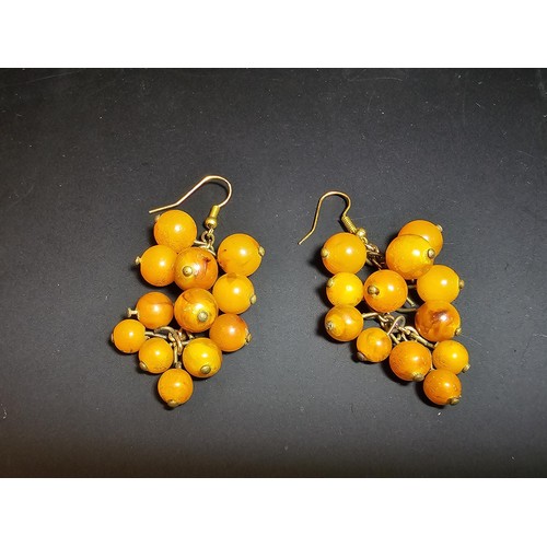 265 - Pair of vintage stunning genuine amber beaded drop earrings in the form of a bunch of grapes, each a... 