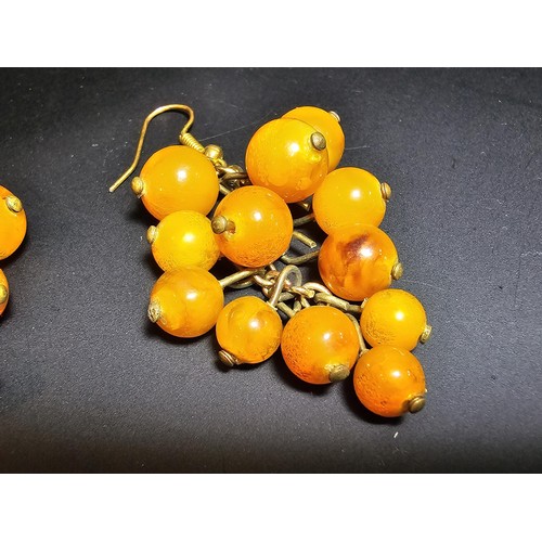 265 - Pair of vintage stunning genuine amber beaded drop earrings in the form of a bunch of grapes, each a... 