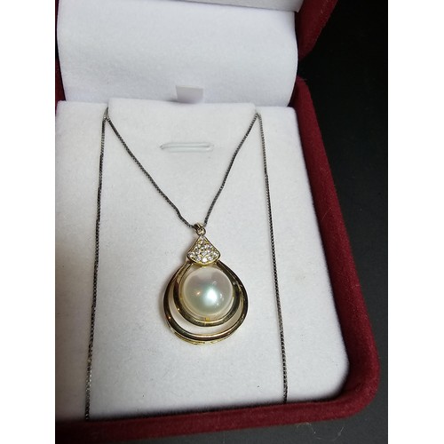 267 - Good gilt on 925 silver pendant inset with a large genuine pearl & CZ stones set on a 18