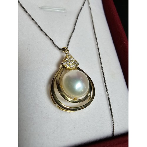 267 - Good gilt on 925 silver pendant inset with a large genuine pearl & CZ stones set on a 18