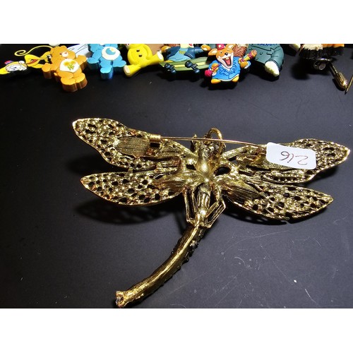 280 - A suite of collectable badges to inc. a large impressive dragonfly formed brooch inset with many spa... 