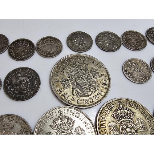 290 - A qty of 22x Pre - 1947 silver british coins to inc. half crown, two shillings coins, one shilling c... 