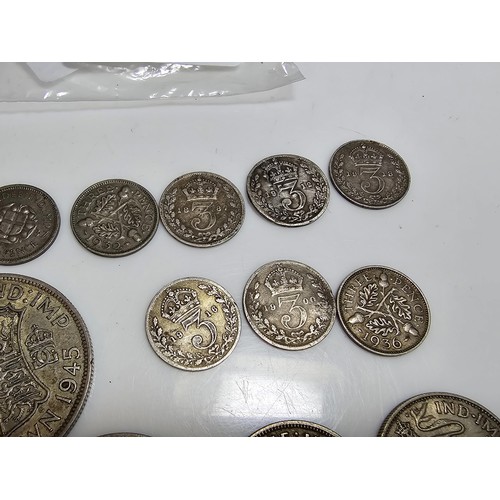 290 - A qty of 22x Pre - 1947 silver british coins to inc. half crown, two shillings coins, one shilling c... 