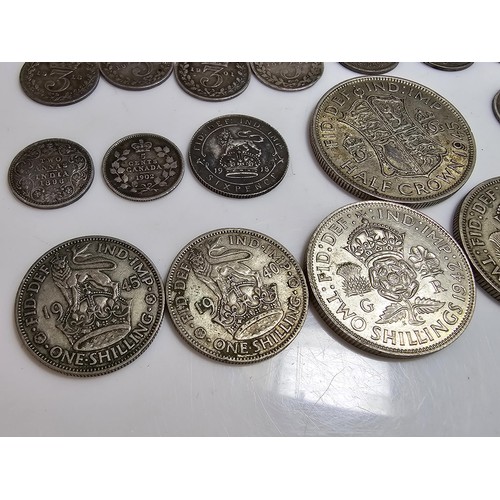 290 - A qty of 22x Pre - 1947 silver british coins to inc. half crown, two shillings coins, one shilling c... 