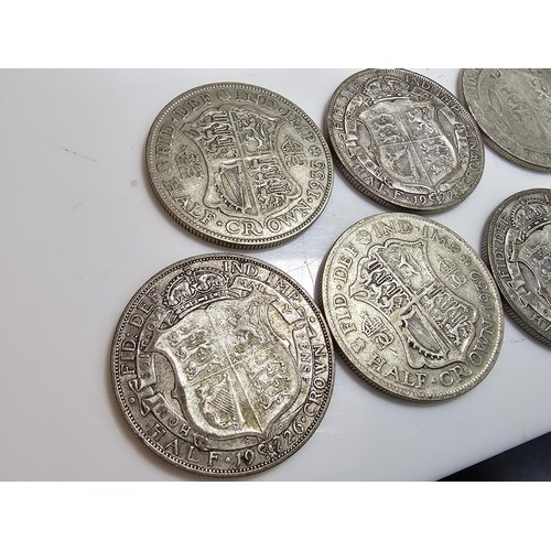 293 - Qty of 7x Silver British half crown coins, they all Pre date 1947. have a total weight of 97.1g.