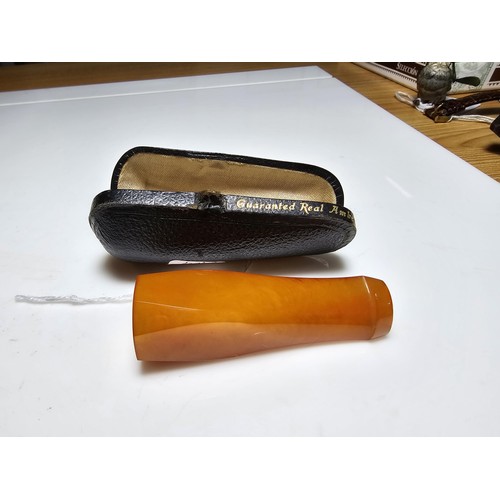 305 - A good quality Solid butter scotch amber cigar cheroot holder fitted in its original case in excelle... 